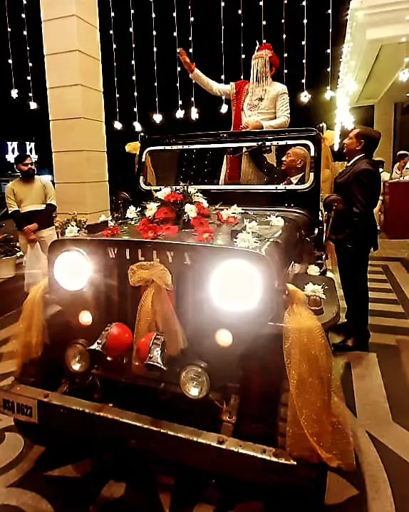 Open Willys Jeep decorated vintage wedding jeep