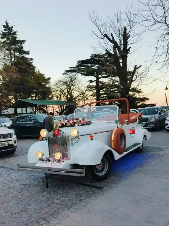 Decorated white vintage 1930s wedding car in Dehradun