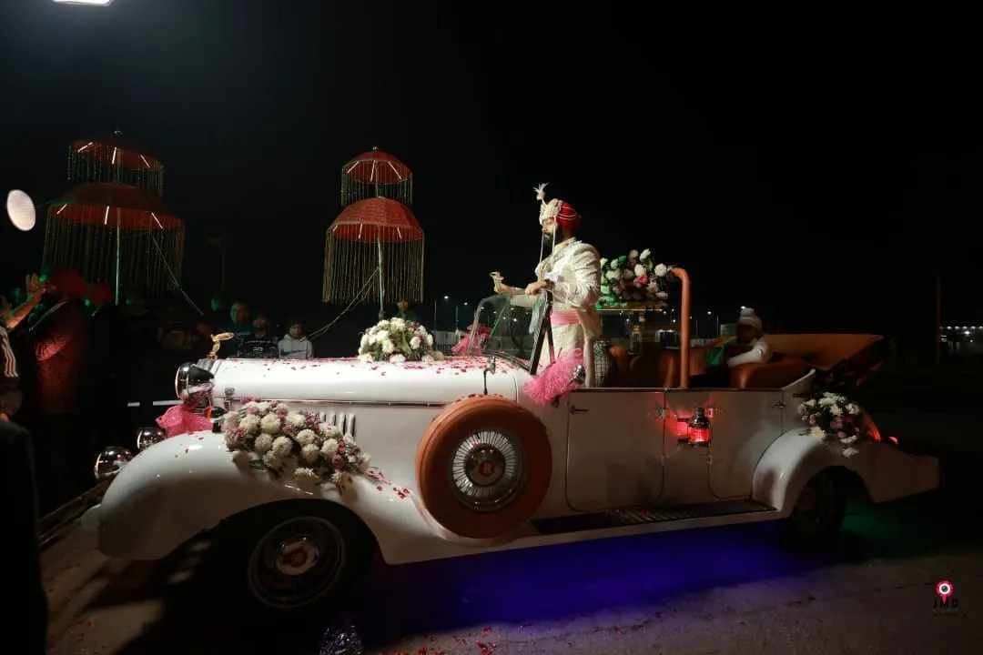Decorated white vintage wedding car in baraat in Delhi